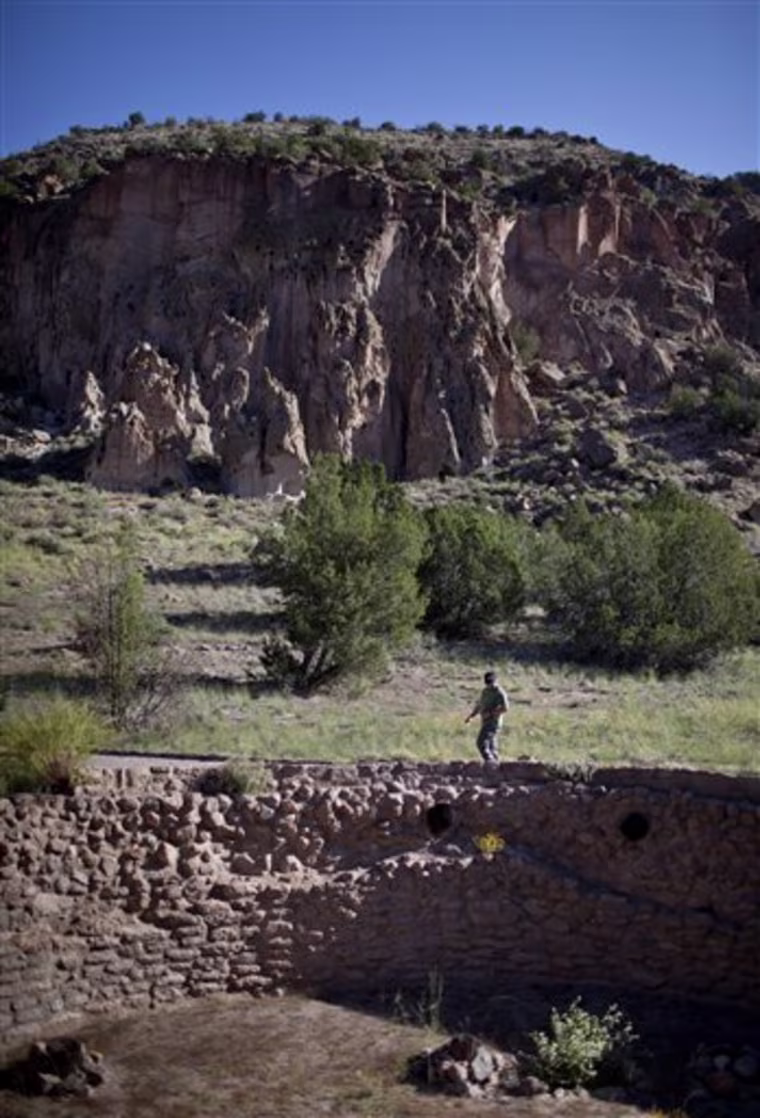 Rick Germain of Rochester, NY, walks past Big Kiva in Bandelier National Monument near Los Alamos, N.M. on Monday, Sept. 26, 2011. Following closure due to the states largest wildfire on June 27, 2011 and the threat of flash floods, the main archeological sites in Frijoles Canyon opened, but visitors must take a shuttle in rather than driving their own vehicles. (AP Photo/Craig Fritz)